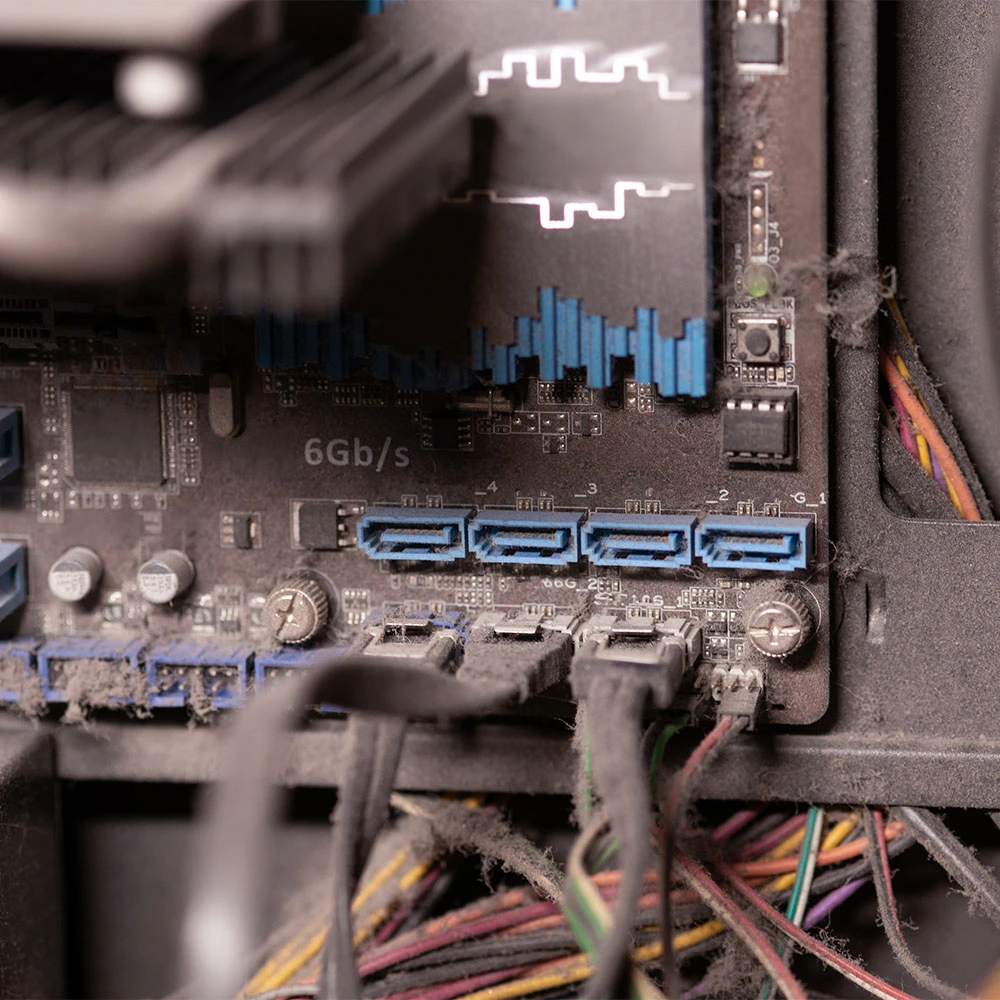 Professional computer cleaning process showing clean internal components