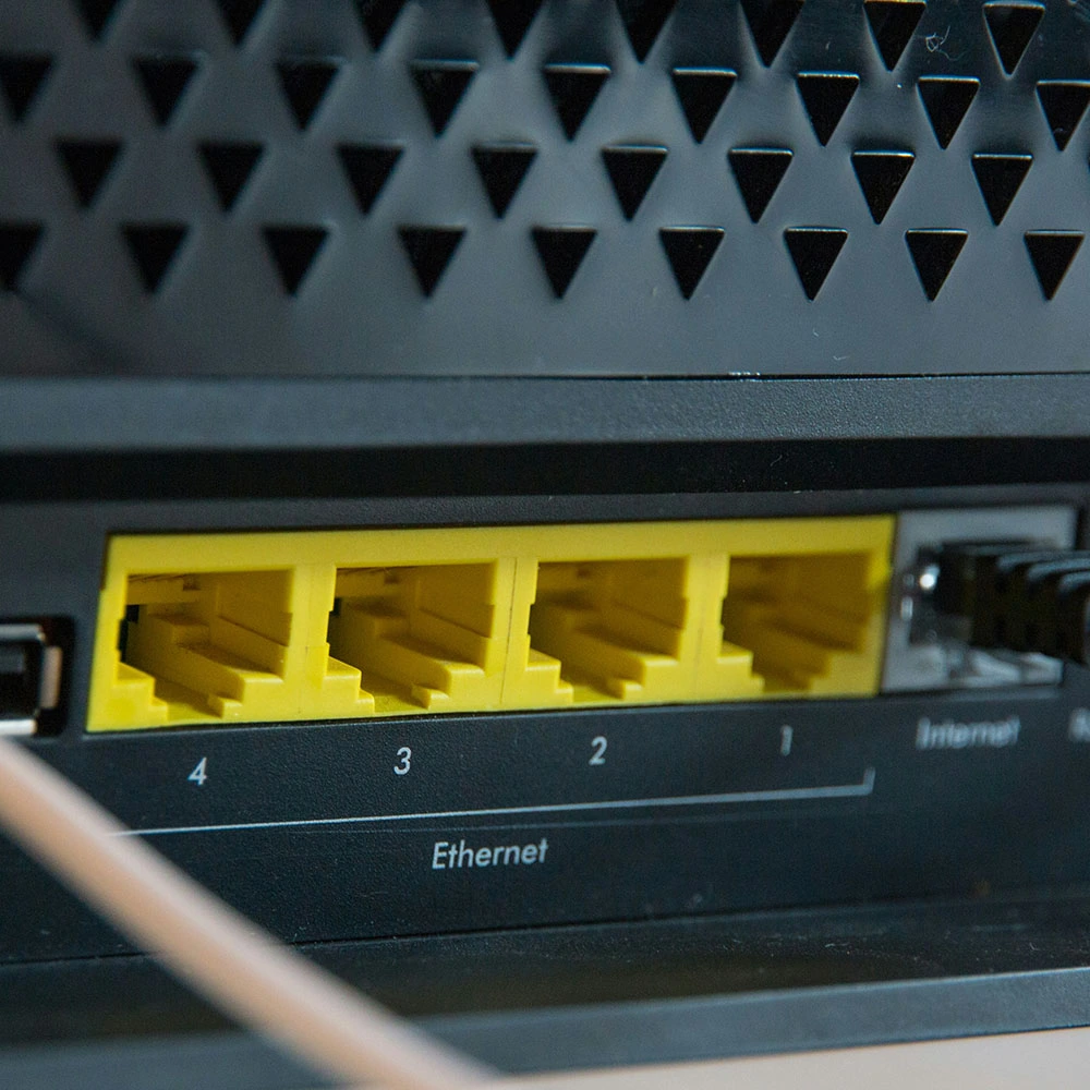 Professional router setup process showing network configuration